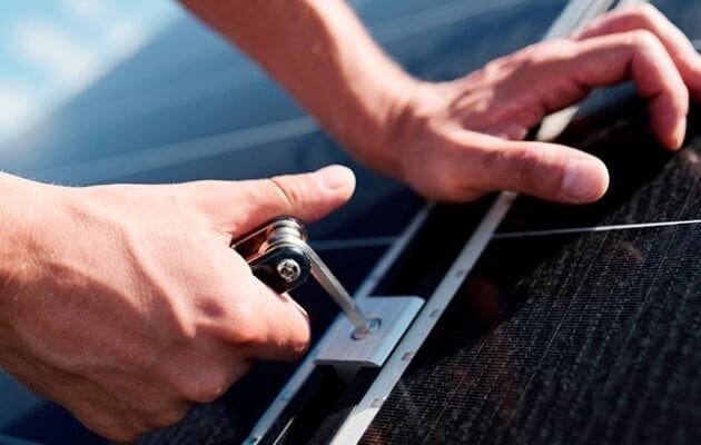 Electrician installing a solar pannel